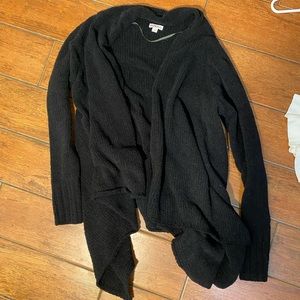 Fuzzy black open sweater.